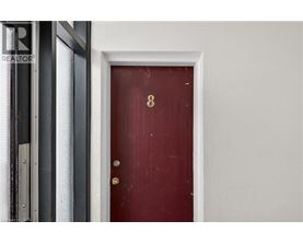 A red door with the number 8 on it.