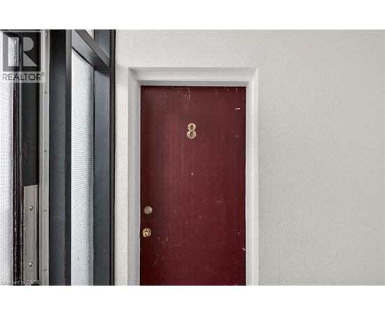 A red door with the number 8 on it.