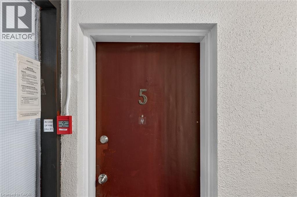 A brown door with the number 5 on it.