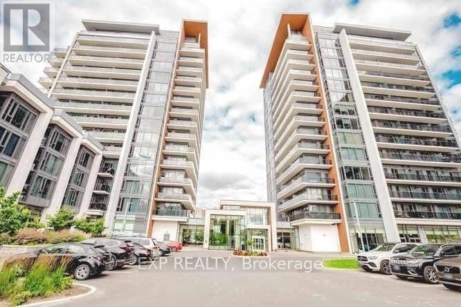 Two modern apartment buildings with cars parked in front.