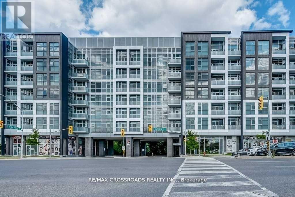 A modern multi-story building with a glass facade is the main focus of the image.