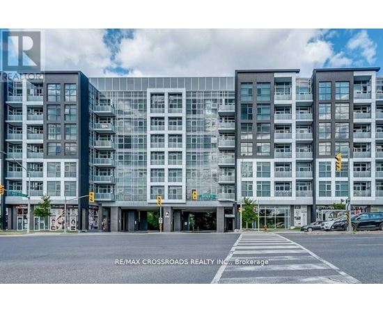 A modern multi-story building with a glass facade is the main focus of the image.
