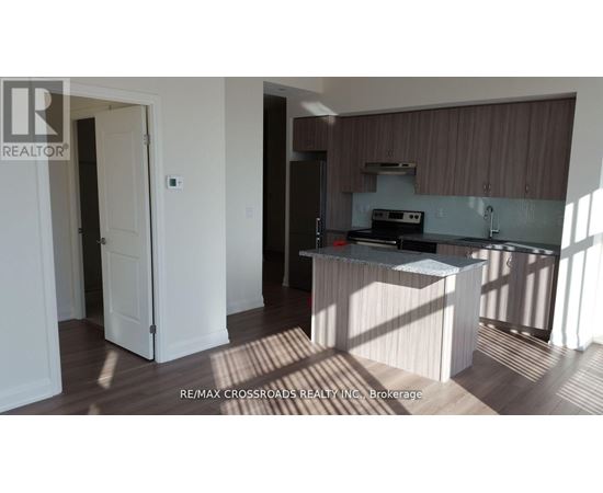 A kitchen area with a sink and a counter.