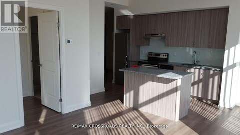 A kitchen area with a sink and a counter.