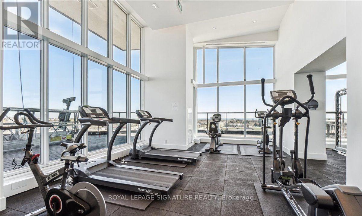 A gym with treadmills and exercise bikes is shown.
