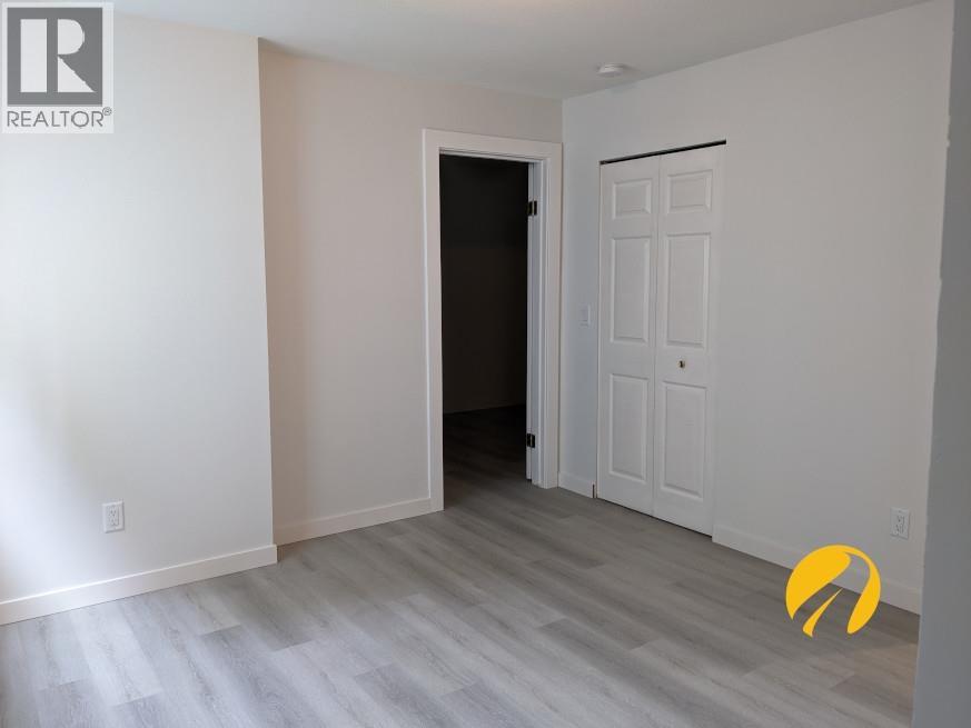 A room with a door and a white door.