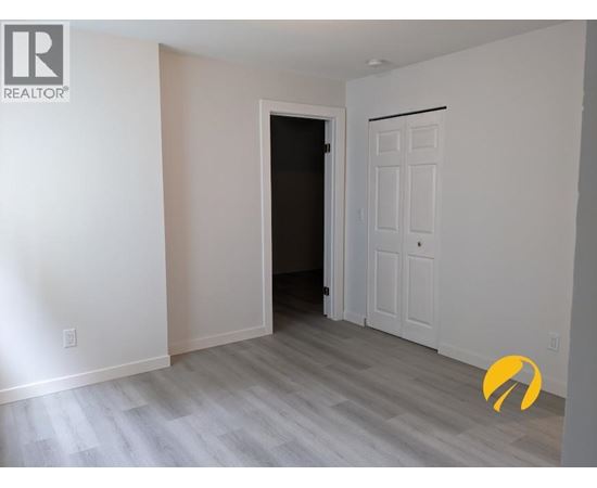 A room with a door and a white door.