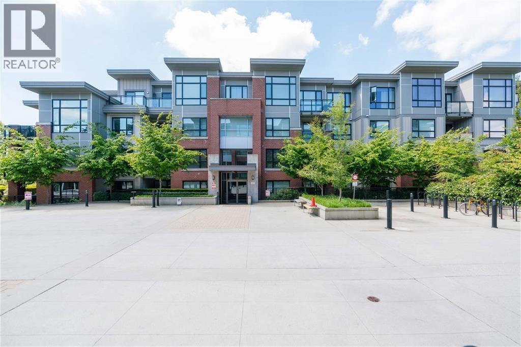 A large building with a lot of windows in front of it.