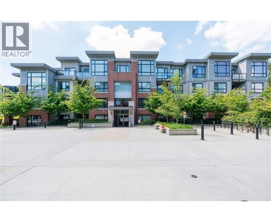 A large building with a lot of windows in front of it.