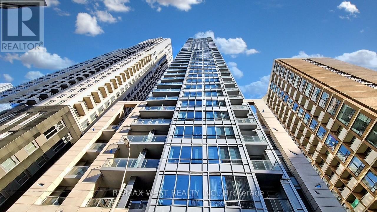 A tall building with a blue sky in the background.