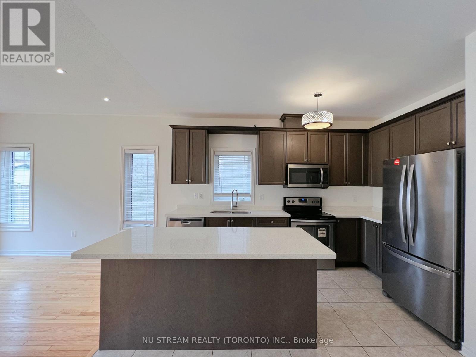 A kitchen with a large island in the middle.