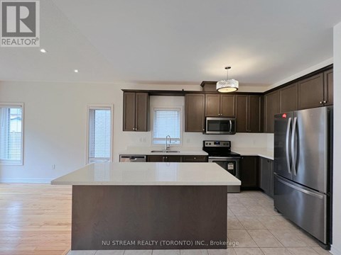 A kitchen with a large island in the middle.