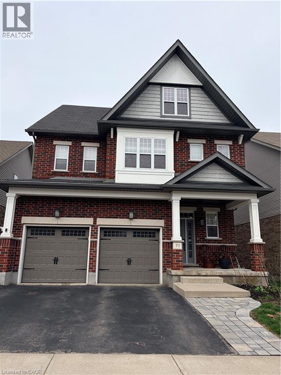 A house with a brick facade and a grey roof.