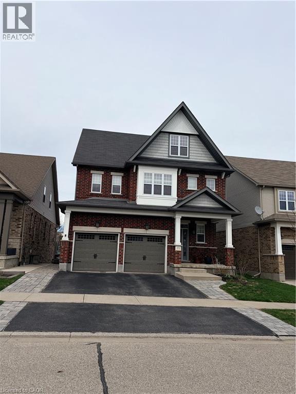 A large house with a garage is shown in the image.