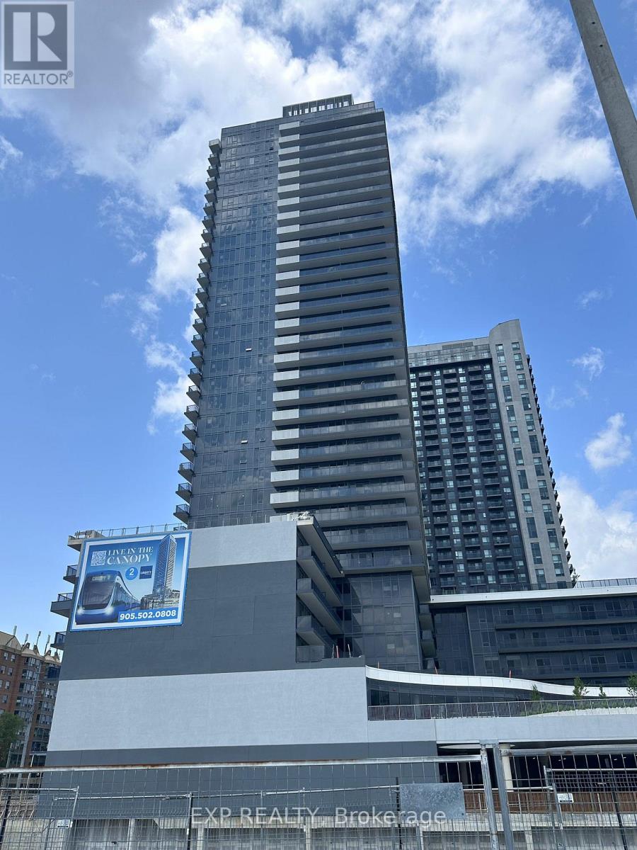 A tall building with a billboard on the side of it.