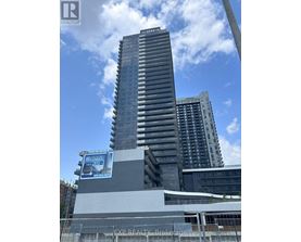A tall building with a billboard on the side of it.