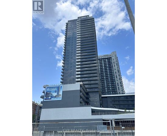 A tall building with a billboard on the side of it.