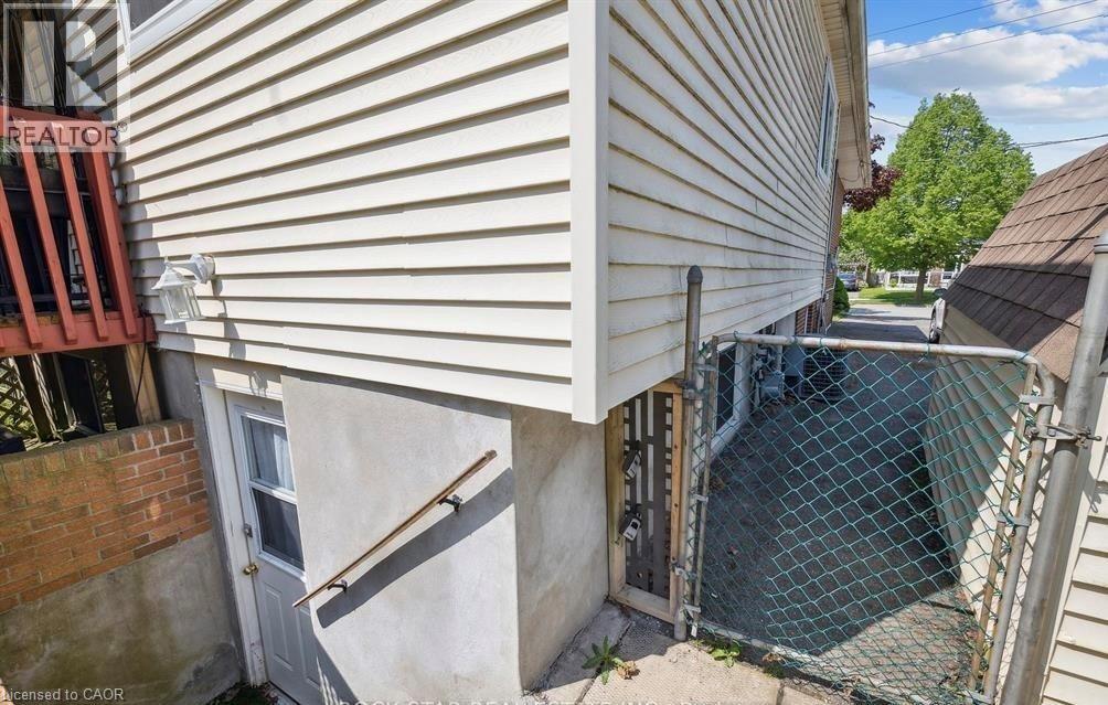 A view of a house with a fenced area in front.