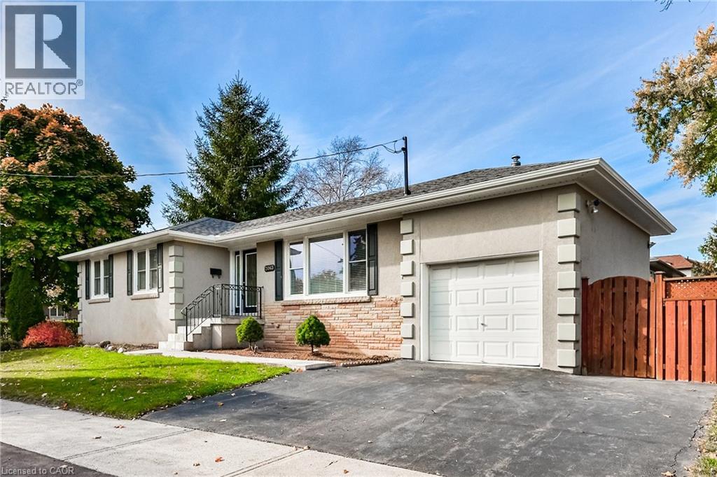 A house with a garage is for sale.