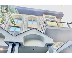 A building with the sign RE/MAX CROSSROADS REALTY INC. Brokerage.