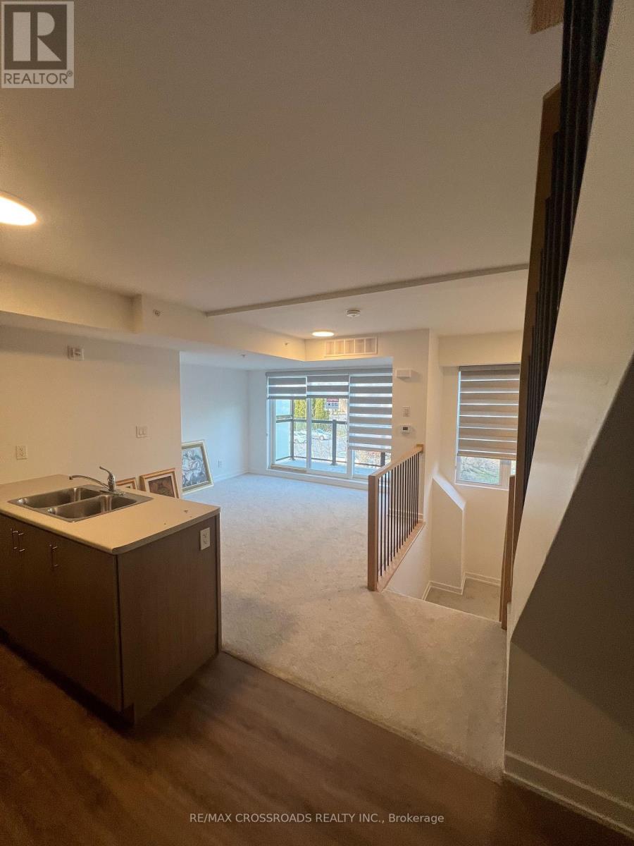 A kitchen with a sink and a window.