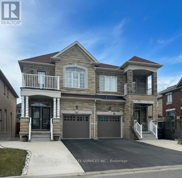 A two-story house with a garage is for sale.