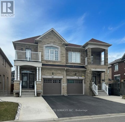 A two-story house with a garage is for sale.
