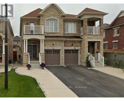 A large house with a garage is shown in the image.