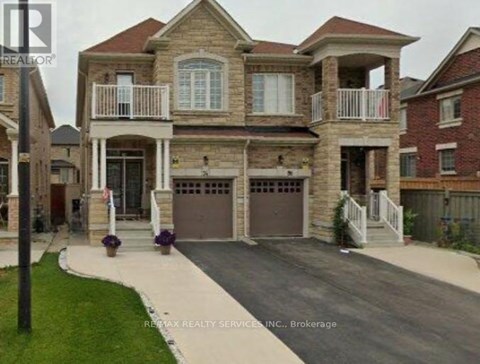 A large house with a garage is shown in the image.