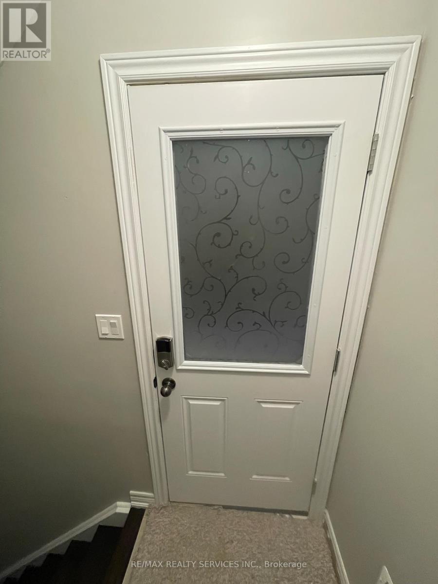 A white door with a glass window and a handle.