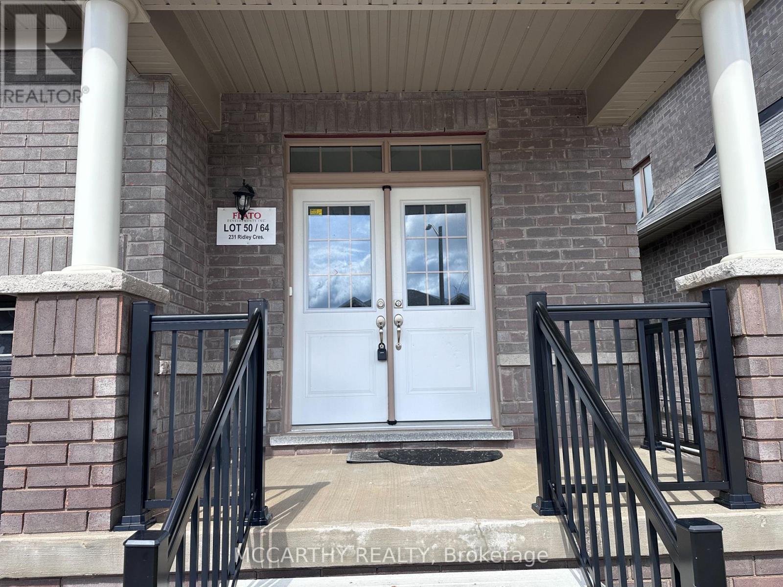The front door of a house with a sign that reads "Lot 6164".
