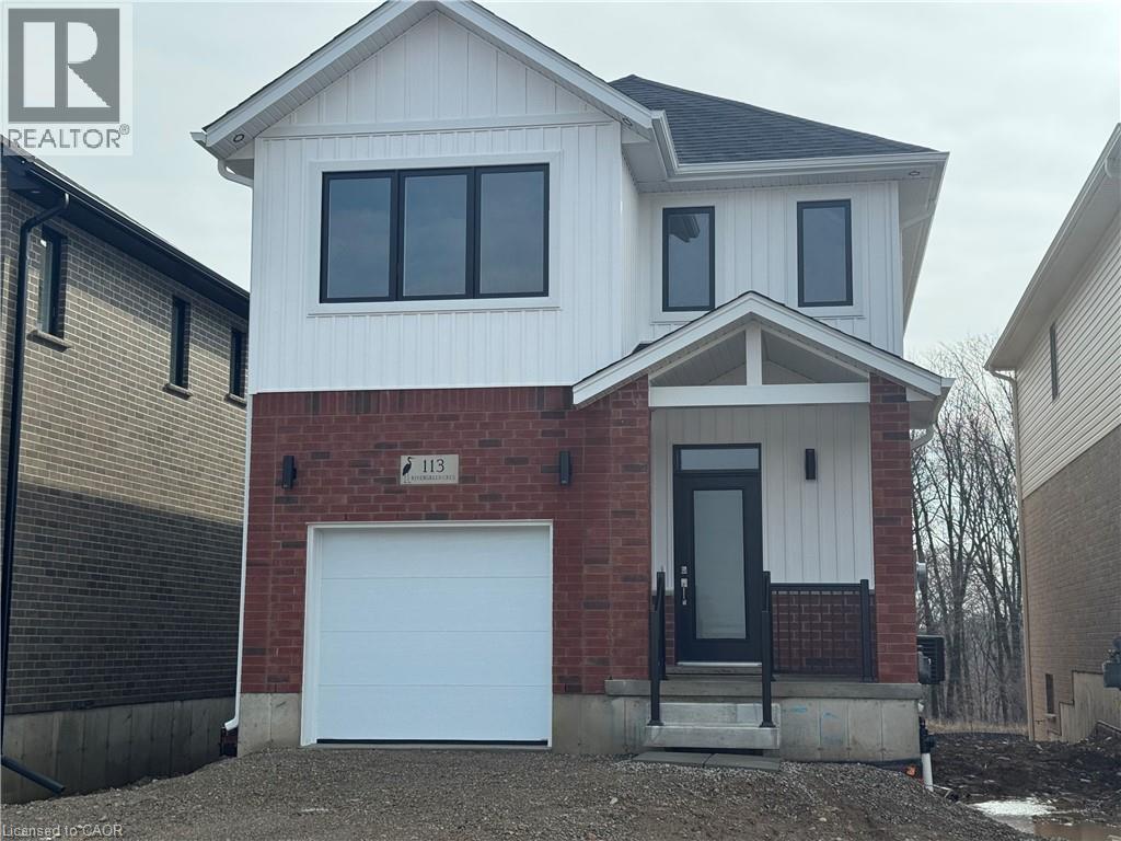 A two-story house with a garage is for sale.