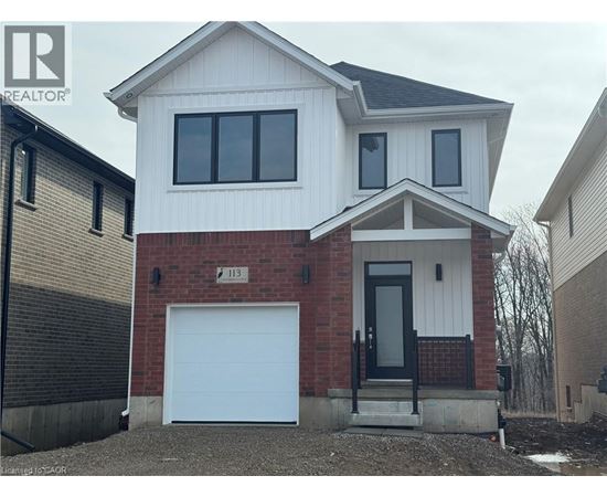 A two-story house with a garage is for sale.