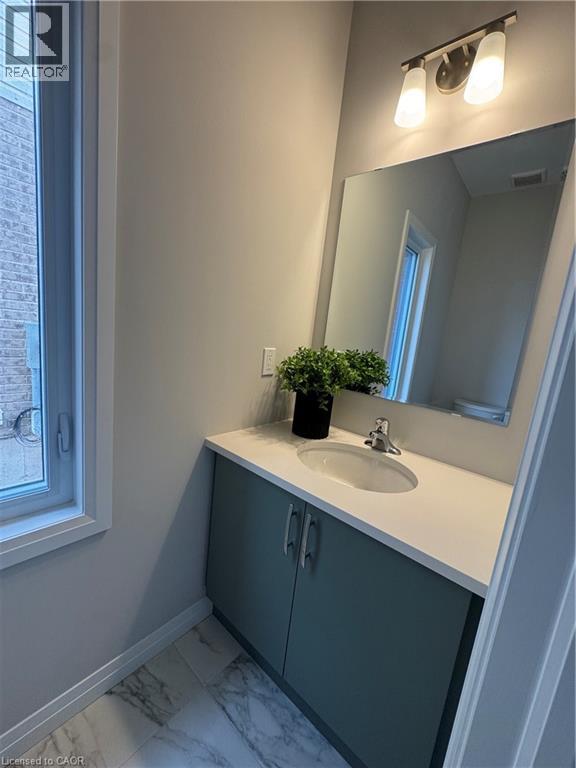 A bathroom with a sink and a mirror.