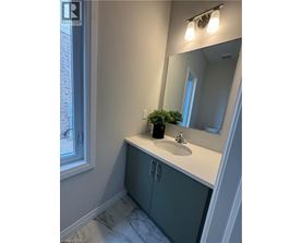 A bathroom with a sink and a mirror.