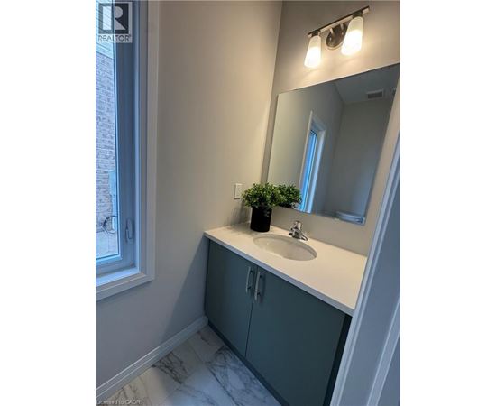 A bathroom with a sink and a mirror.