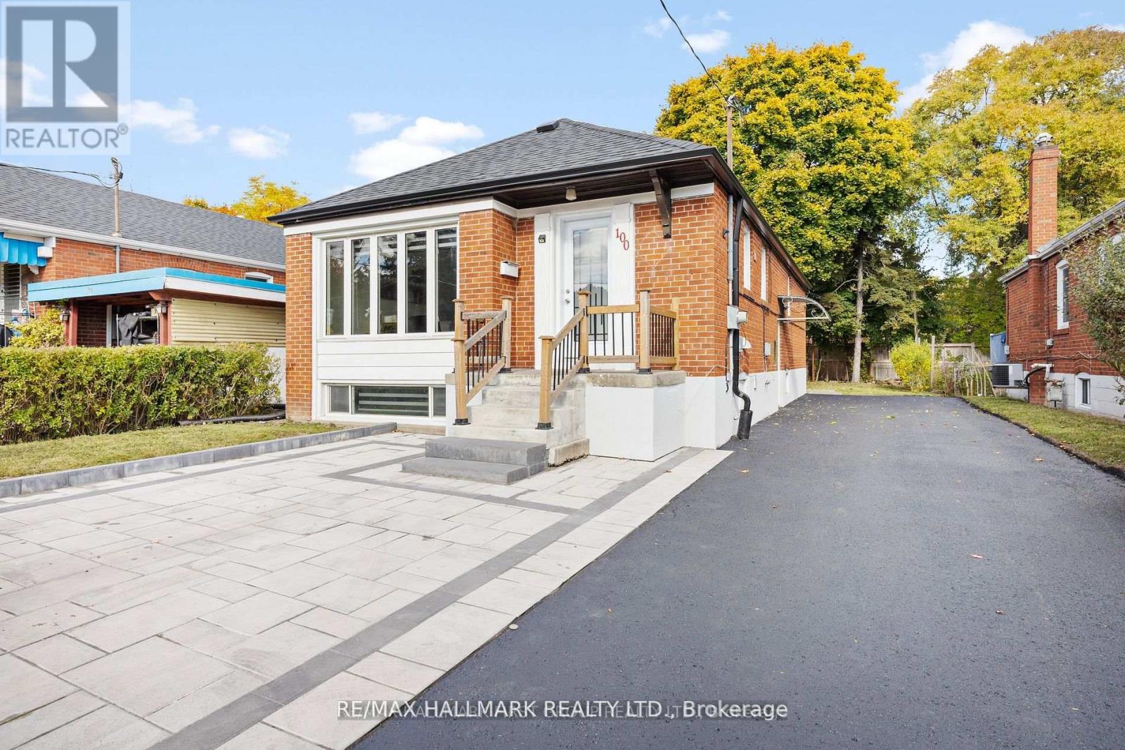 A house with a brick exterior and a white door is for sale.