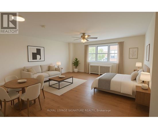 A well-lit, spacious bedroom and living room with a dining table and chairs.