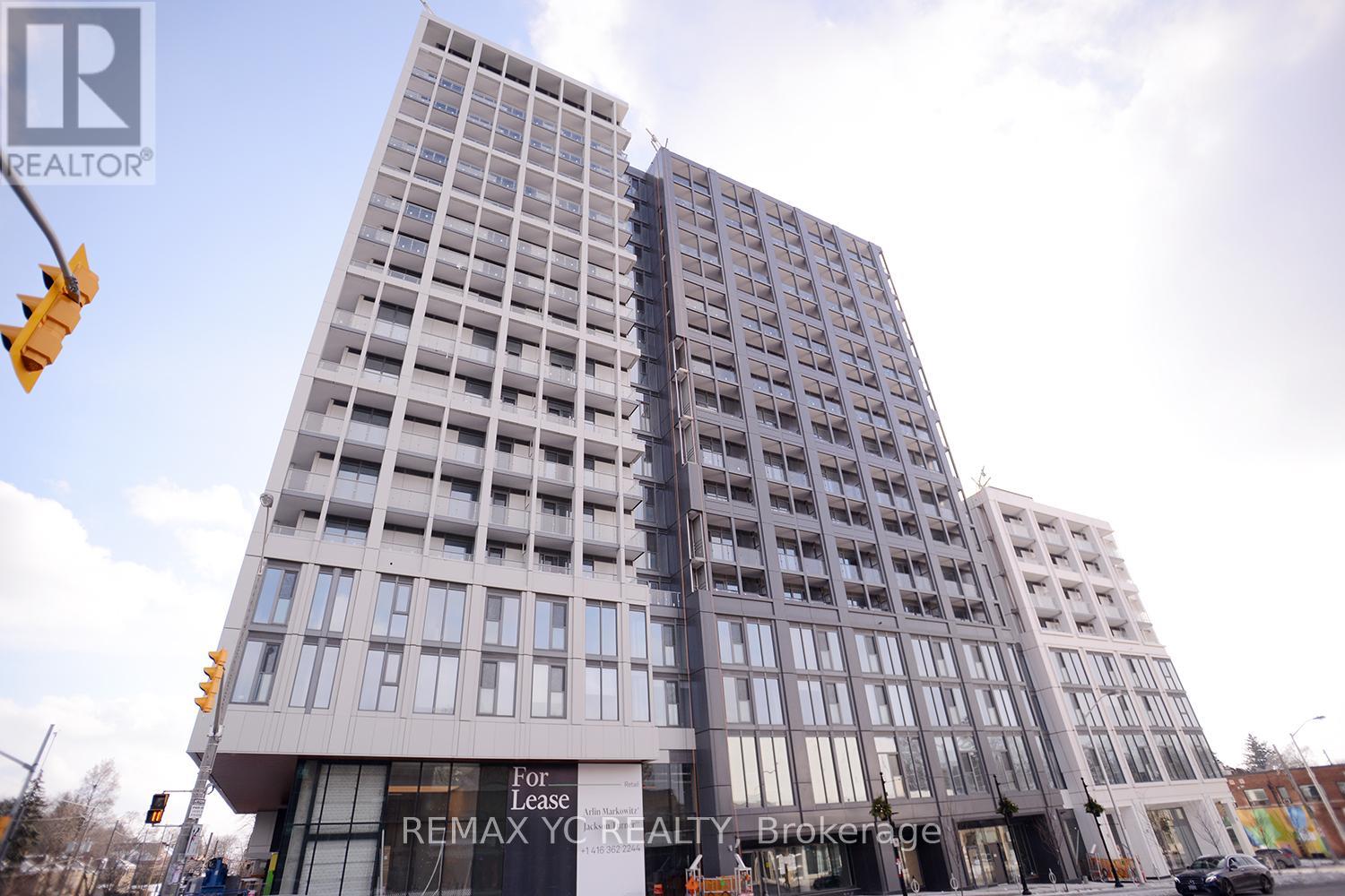 A tall building with a sign that says "For Remax Your Realty Brokerage".
