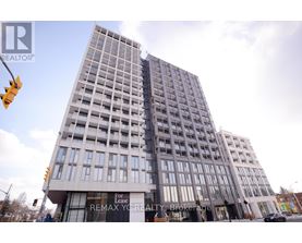 A tall building with a sign that says "For Remax Your Realty Brokerage".
