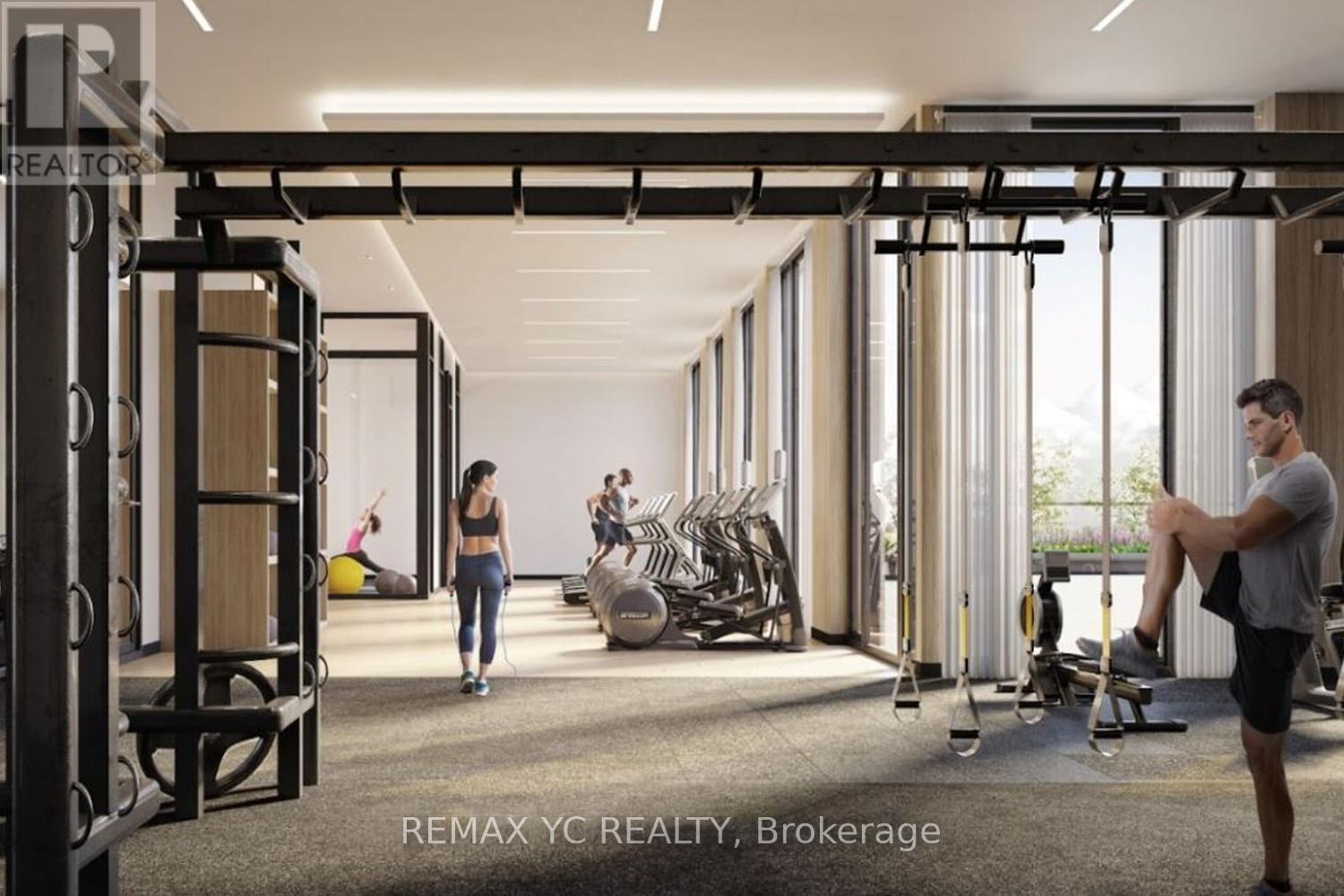 A gym with a man and woman working out.