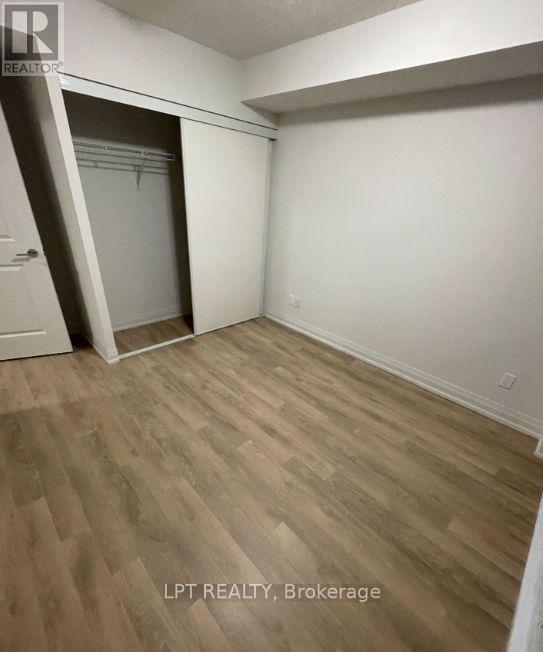 A room with a white door and a white wall.