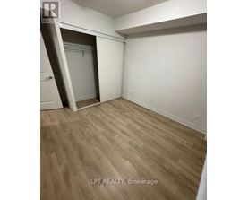A room with a white door and a white wall.