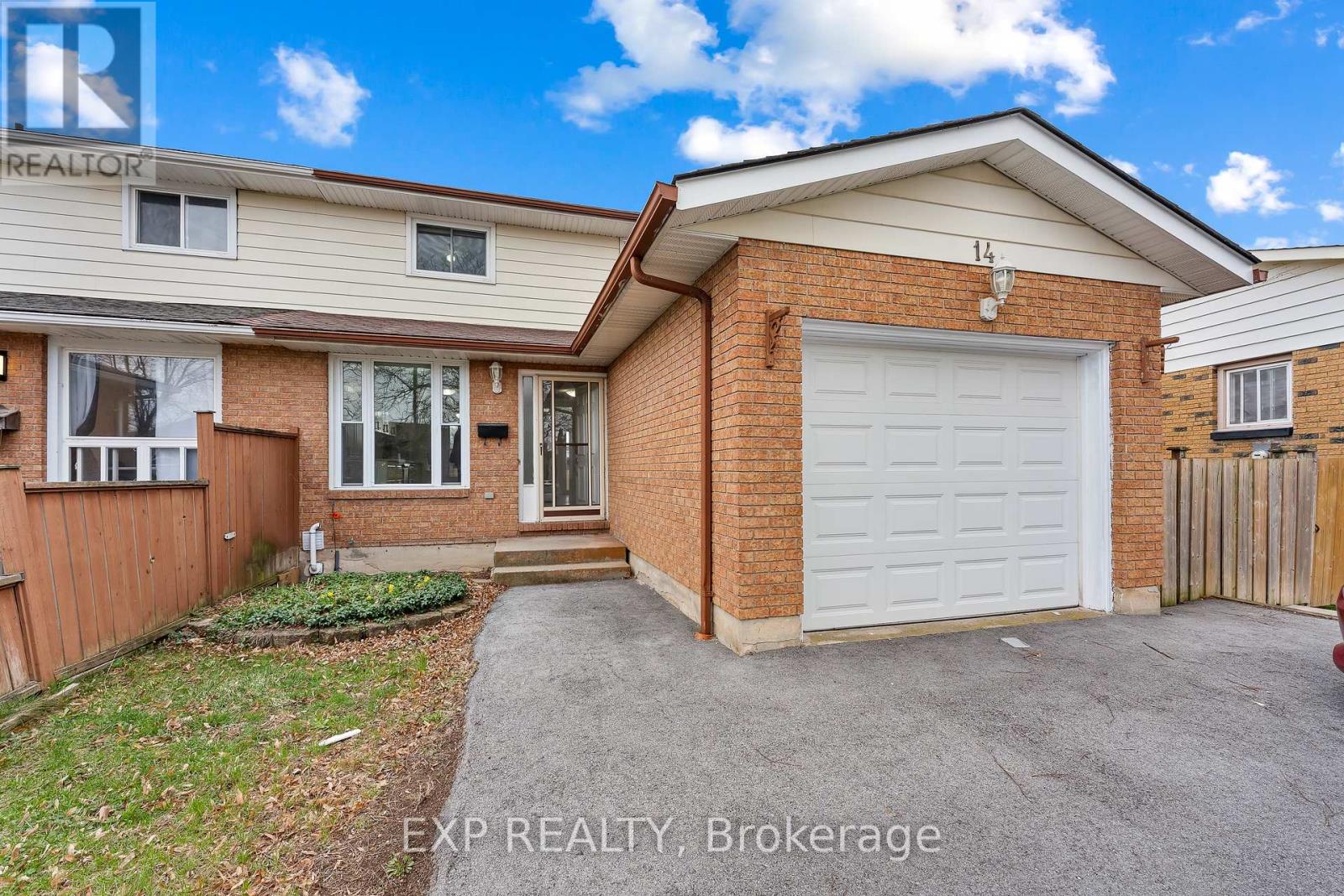 A house with a garage is for sale.