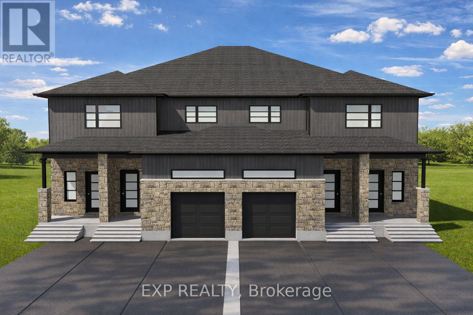 A modern house with a stone facade and a large front yard.