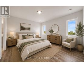 A bedroom with a large bed, a chair, and a painting on the wall.