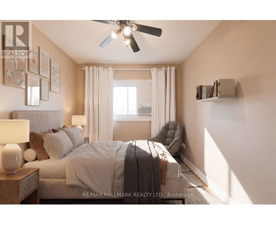 A bedroom with a large bed and a ceiling fan.