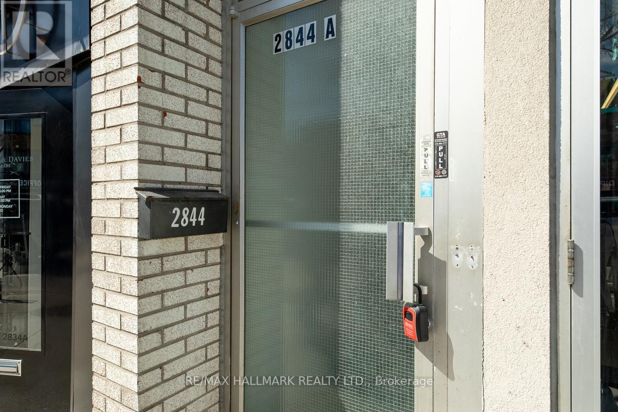 A glass door with a lock and a sign that says 2844 A.