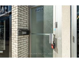 A glass door with a lock and a sign that says 2844 A.