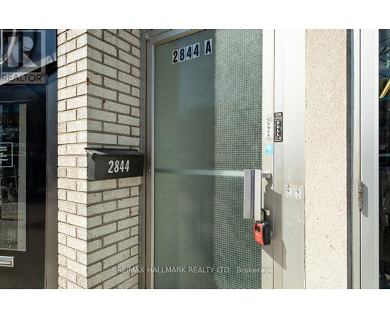 A glass door with a lock and a sign that says 2844 A.